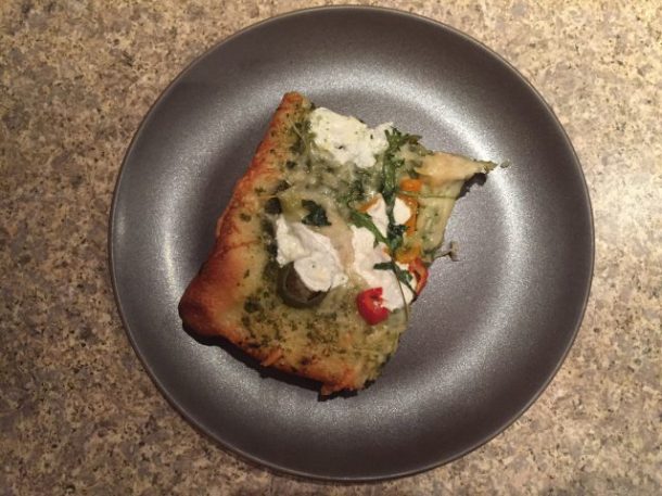 Slice of pesto pizza